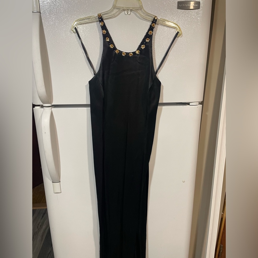 Black gown...gold and black flower embellishment...size 7